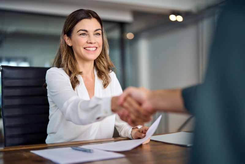 Interview An interviewee shakes the hand of a legal professional after being interviewed for current vacancy