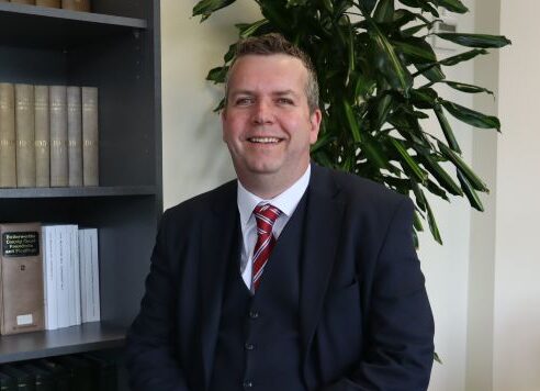 An image of Jon Bostock, the CEO of the PM Law Group