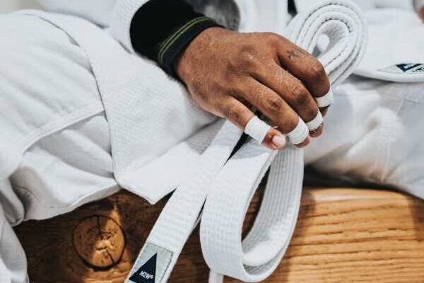 Martial Arts A man rests on a bench after a martial arts class