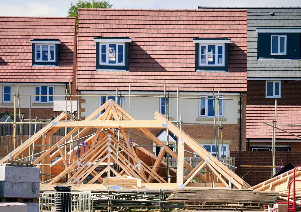 A row of new-build houses behind a new-build construction site