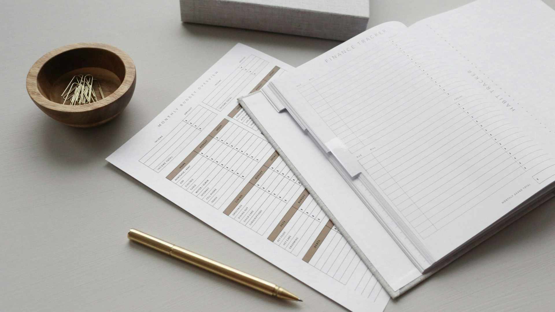 A booklet of documents and a pen placed on a desk