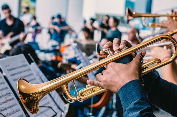 Strata Brass Band A closeup image of a brass band performing to an audience