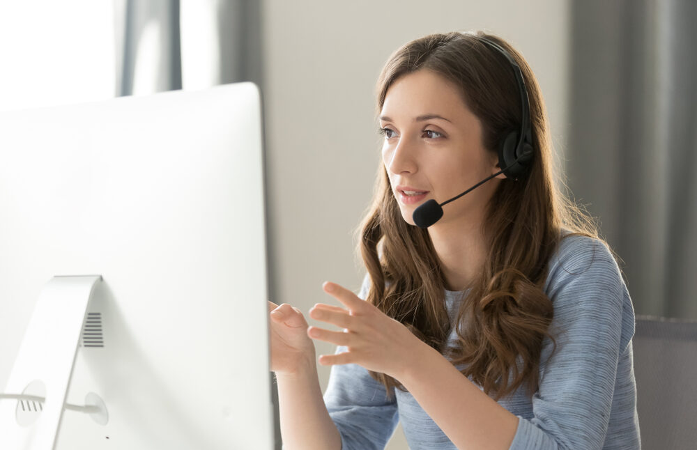 Serious,Call,Center,Operator,In,Wireless,Headset,Talking,With,Customer,