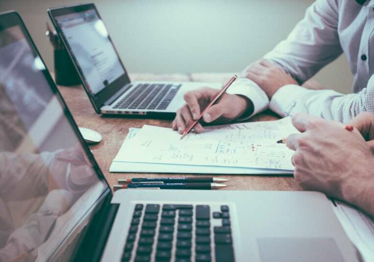 Legal Business Reinvigoration Two legal professionals make notes and formulate new business plans