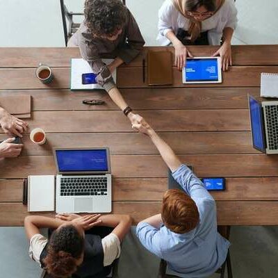 Work Meeting Employees engage in a work meeting in a bright and modern office