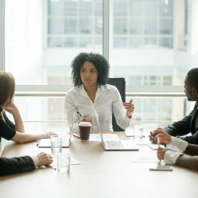 Black,Female,Boss,Leading,Corporate,Multiracial,Team,Meeting,Talking,To