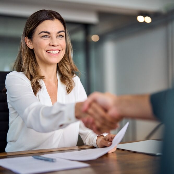 Woman manager handshake at office meeting