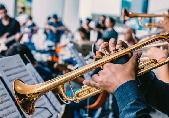 Strata Brass Band A closeup image of a brass band performing to an audience